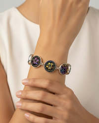 Early 1900s Czech Republic Carnival Luster Glass Buttons set in Sterling Silver Bracelet — worn on model