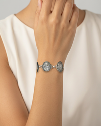 Early 1900s Czech Republic Silver Luster Glass Buttons set in Sterling Silver Bracelet — worn on model