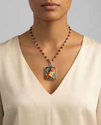 Arita Bird Parrot Toshikane Button set in Sterling Silver W/ Garnet Stone Necklace — worn on model