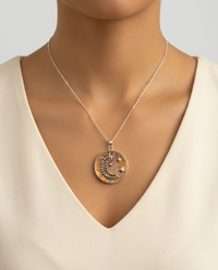 Victorian Tinted Metal Moon & Star Button set in Sterling Silver Necklace W/ Satellite Chain — worn on model