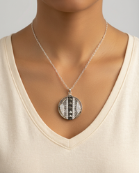 Victorian Carved Pearl Ornate Floral Button with Steel Carved Center Design Button set in sterling Silver Pendant w/ Sterling Chain Accent — worn on model