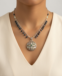 Victorian Carved Pearl with Steel Facet & Topaz Accent set in Sterling Silver — worn on model