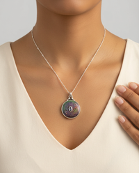 Victorian Carved Pearl Button with Tourmaline Facet Center Stone set in Sterling Silver Pendant w/ Sterling Chain Accent — worn on model
