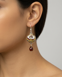 Victorian Hand Painted Enamel with Steel Facet Accent Button set in Sterling Silver With Garnet Facet Stone Accent. 1" length — worn on model