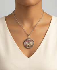 Victorian Carved Shell Tinted Button set in Sterling Silver w/ Aquamarine Center Stone & Tanzanite Necklace — worn on model