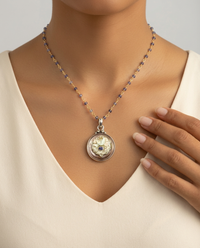 Victorian Caved Shell Button with Iolite Center Button set in Sterling Silver — worn on model