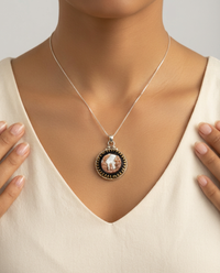 Victorian Carved Shell Village Scene Set in Glass & Brass Button in Sterling silver — worn on model