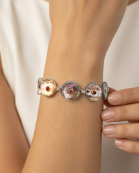 Victorian carved Pearl Buttons with Garnet Stone Centers Set in Sterling Silver Bracelet — worn on model