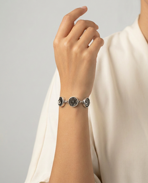 Early 1900s Czech Republic Silver Luster Glass Buttons set in Sterling Silver Bracelet — worn on model