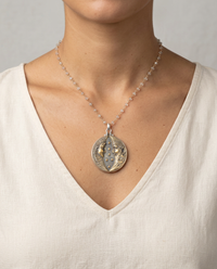 Victorian Picture Metal Button Sol Y Luna set in Sterling Silver w Facet Stone Rosary Accent — worn on model