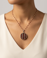 Victorian Design in   Glass Mosaic Glass inlaid in Victorian Metal Button set in Sterling Silver W/ Rosary Garnet Necklace Accent — worn on model