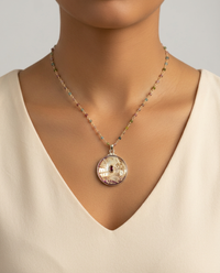 Victorian Carved Pearl Button set in Sterling Silver w/ garnet Stone center & Tourmaline Rosary Accent — worn on model