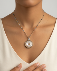 Victorian Irridescent Pearl w/ Ornate Brass Border Button set in Sterling silver pendant w/ Tourmaline Stone Necklace — worn on model