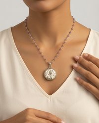 Victorian Carved Pearl image of Woman & Flowers set in Sterling Silver with Amethyst Stone accent — worn on model