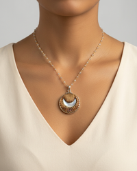 Victorian Button Opalescent Glass Moon set in Ornate Brass Button w/ Stone Rosary Accent — worn on model